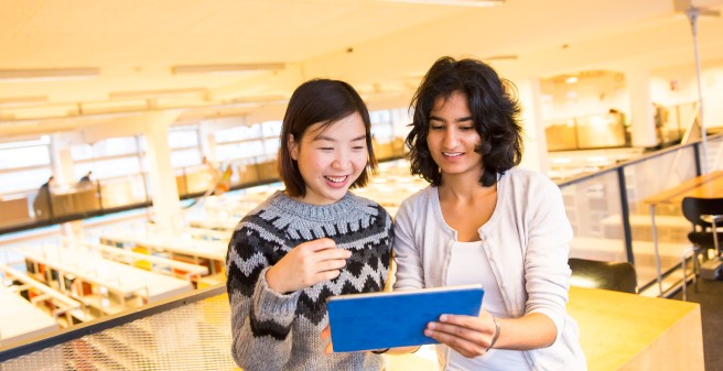 two students in the reading area